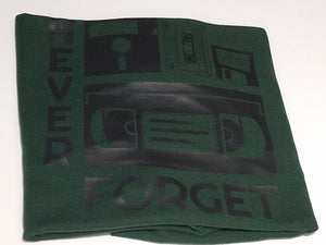 Black ink Never Forget design with cassette, VHS, and retro icons on forest green unisex short sleeve Chozzen Few cotton T-shirt